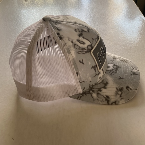 The CLASSICS Yupoong X HUK Men’s Camo Snapback Trucker Hat. - Picture 2 of 5